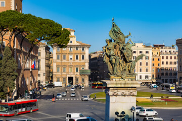 Obraz na płótnie Canvas Liberty statue in front of Altare della Patria (Altar of the Fatherland) monument in Piazza Venezia (square of Venice), Rome, Iyaly