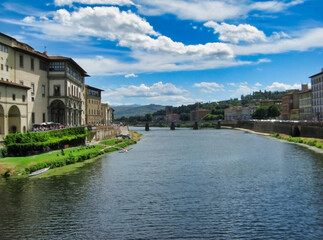 Fototapeta premium Arno river in the city of Florence. Historic houses and bridge. Tuscany. Italy. Europe