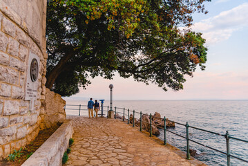 Opatija, Croatia - June 4, 2019: senior couple walking by city quay