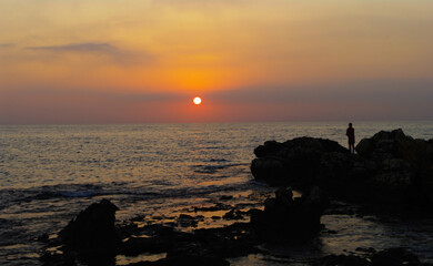 Fototapeta na wymiar Sunrise and Fisherman