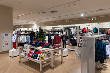 Modern fashionable brand interior of clothing store inside shopping center