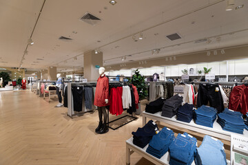 Modern fashionable brand interior of clothing store inside shopping center