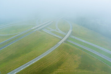A dense fog in the early morning around the bridge across US 65 Highway near Satsuma, Alabama