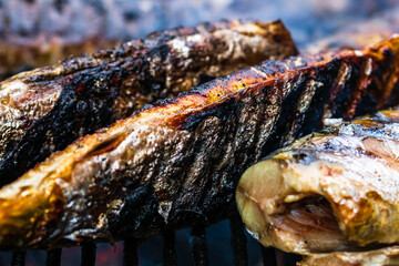 Grilled fish on charcoal grill. Fresh fish barbecue
