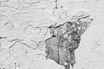 Texture of a concrete wall with cracks and scratches which can be used as a background