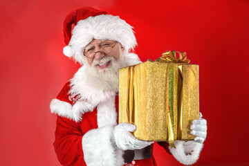 Emotional senior male model old man with a natural white beard in the role of Father Christmas