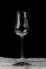 Transparent dirty wine glass on wooden table