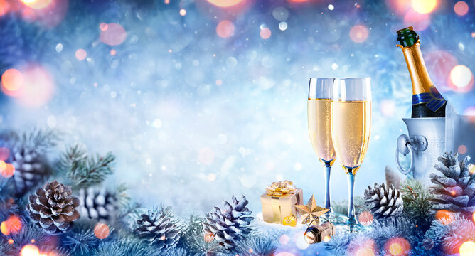 Christmas Celebration With Champagne - Flutes On Snow With Fir Branch And Bokeh