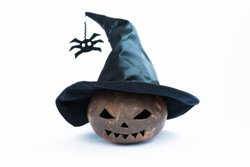 A pumpkin made from clay. Pumpkin for Halloween, the pumpkin is wearing a witch hat. Attributes for...