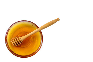 Honey in bowl with wood stick isolated on white.