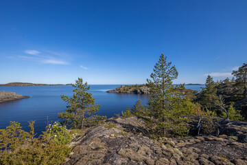 Fototapeta na wymiar Northern nature. Karelian skerries. lake Ladoga. Channel of lake Ladoga with stony banks.