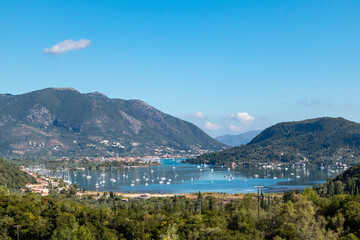 Vlicho bay view from hills of Lefkada island Katochori village, Ionian Islands, Greece. Boats, blue sea and sky surrounded by summer greenery