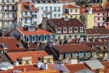 Fototapeta na wymiar Building facades in the center of Lisbon fill the urban scene with historic and traditional architecture.
