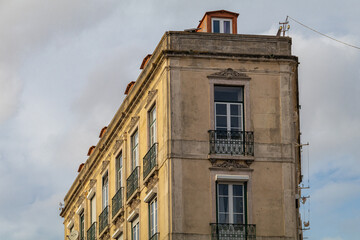 Building facades in the center of Lisbon fill the urban scene with historic and traditional architecture.