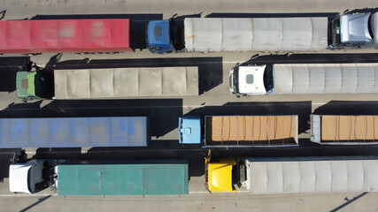 Top view of trucks with loaded grain in containers.