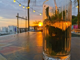 glass of lamonade and the sunset 