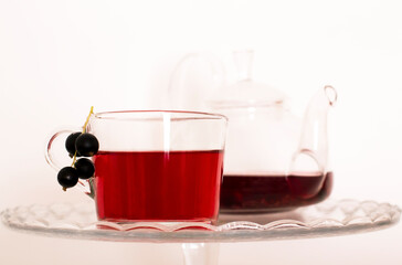 tea with currants on a white background