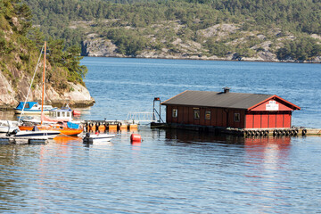 colorful wooden houses on the sea in Osoyro in Norway