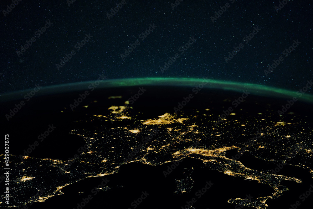 Poster Night planet earth with the lights of megalopolis cities at night and the northern lights. Europe and the cities of Italy, France, Spain and Germany, view from space.