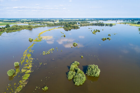 Aerial view of flooded floodplains along river IJssel during high water in summer, Welsumer Waarden, Gelderland and Overijssel, The Netherlands.