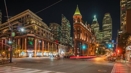 Timelapse view of Toronto cityscape and night traffic including historical landmark Gooderham Flatiron building in downtown Toronto, Ontario, Canada.	