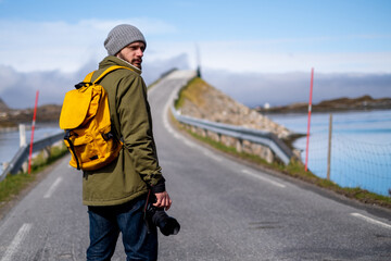 Traveler photographer beautiful long Norwegian road