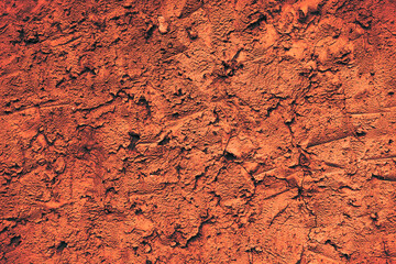 Uneven surface of orange color, abstract background. texture with space for text.