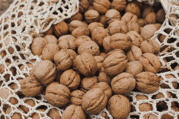 Harvest walnuts. Whole walnuts in shell, background, top view, set of nuts.