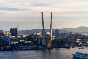 Naklejka premium Urban landscape with a view of the Golden Bridge. Vladivostok, Russia