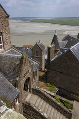 view on roofs at Mont Saint Michel / Normandy / France
beach and sea in the background.
