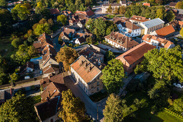 Aerial view of old town in city Kuldiga and red roof tiles, Latvia. Sunny autumn morning.