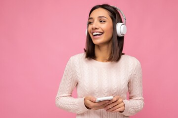 Photo of beautiful joyful smiling young woman wearing stylish casual clothes isolated over...