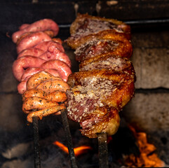 The most traditional Brazilian barbecue, sausage and picanha roasted on a skewer over the grill