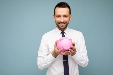 Portrait photo of happy positive smiling young handsome brunet unshaven man with beard with sincere...