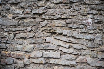 Wall, made of stones in Kuldiga, Latvia.