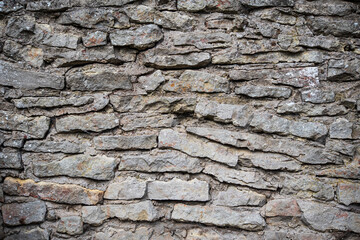 Wall, made of stones in Kuldiga, Latvia.