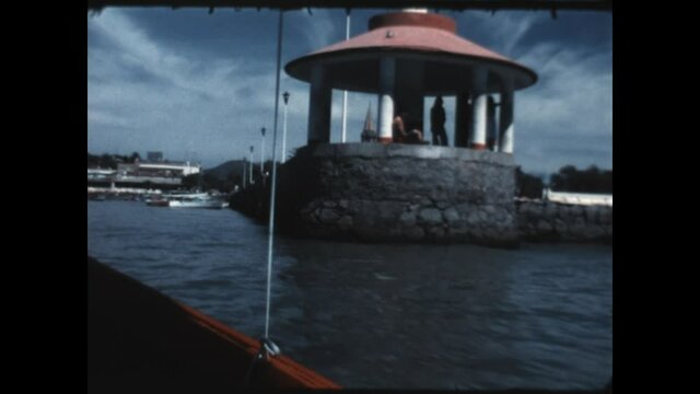 Lake Chapala Pier 1975 - A boat arrives at Muelle de Lago de Chapala, the Lake Chapala Pier, in the town of Chapala on Lake Chapala in Jalisco, Mexico in 1979.