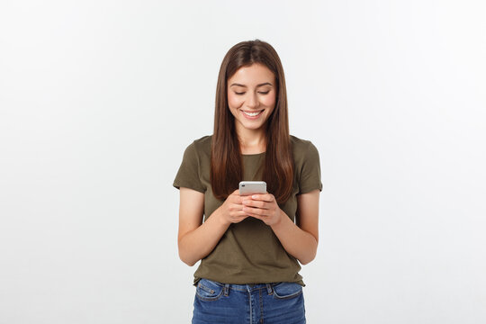 Laughing Woman Talking And Texting On The Phone Isolated On A White Background.