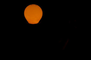Yellow light in the darkness of the fully enclosed room.