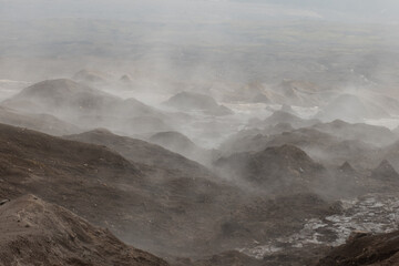 Crater of active volcano Goreliy smoke and clouds. Kamchatlka peninsula. .