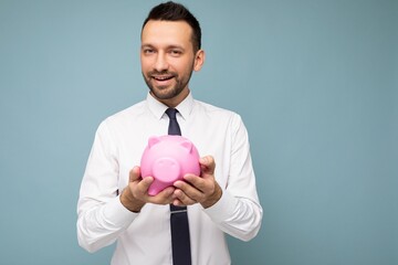 Portrait photo of happy positive smiling young handsome brunet unshaven man with beard with sincere...