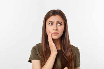 Teen woman pressing her bruised cheek with a painful expression as if she is having a terrible tooth ache - obrazy, fototapety, plakaty
