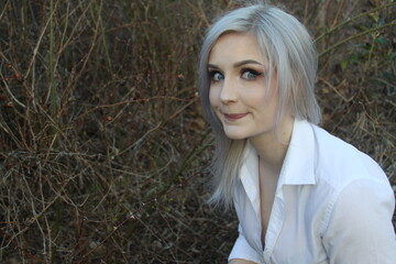 portrait of a silver haired lady making a silly happy face 