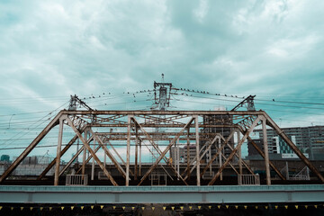 Fototapeta na wymiar Railroad bridge and cloudy sky