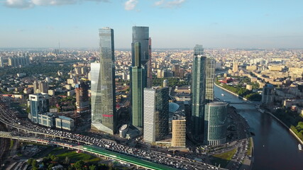 Aerial Moscow cityscape with business centre, river and heavy traffic