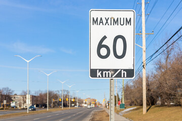 Speed limit road sign in the street, 60 km h maximum in Ottawa city, Canada
