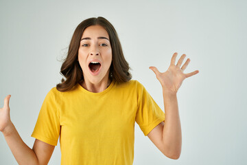 woman in yellow t-shirt posing emotions studio lifestyle