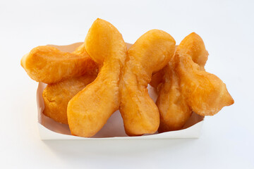 Deep-fried dough sticks or chinese bread sticks on white background.