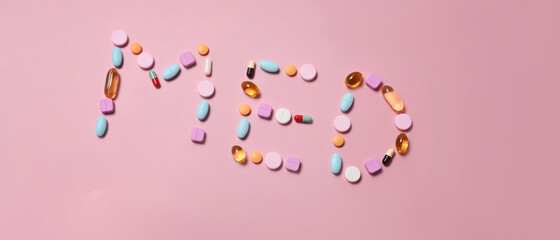 Medical pills on pink background. Medical health care concept.