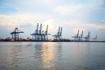 Industrial crane loading Containers in a Cargo freight ship